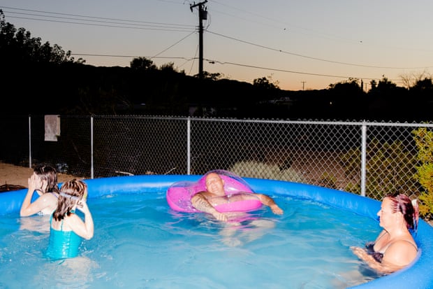 A family from Joshua Tree and Yucca Valley plays in the pool.