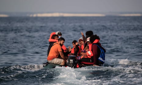 Migrants in a dinghy approach the southern British coastline after crossing the Channel from France in 2020.
