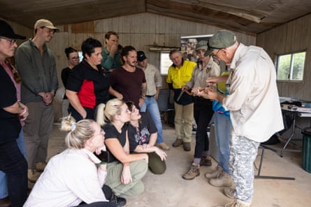 Chris Hay demonstrates how to check a snake’s sex on a Collett’s black snake.