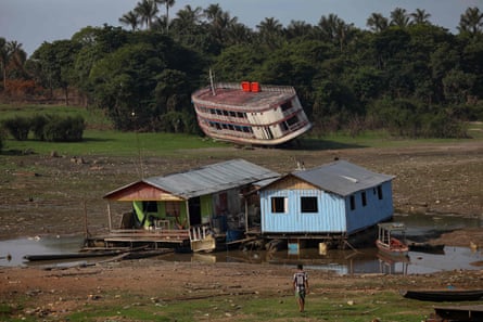 Houseboats and a stranded boat on the Rio Negro, in the district of Cacau Pirera, in Iranduba. On 12 September the government of Amazonas declared a state of environmental emergency due to the high number of fires and drought, affecting navigation and food distribution to the interior of the state.