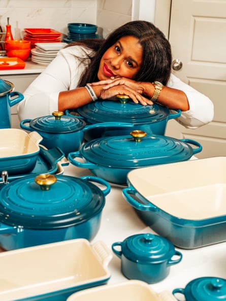 Woman leaning on a blue Le Creuset pot