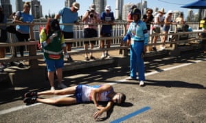 Scotland’s Callum Hawkins of Scotland is prone in the the road.