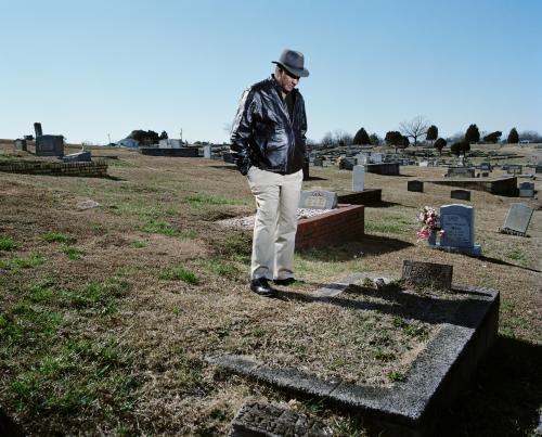 David Baker, 65, at his brother Terry’s grave. Terry Baker died at the age of 16 from a brain tumour and lung cancer, caused by PCB exposure.