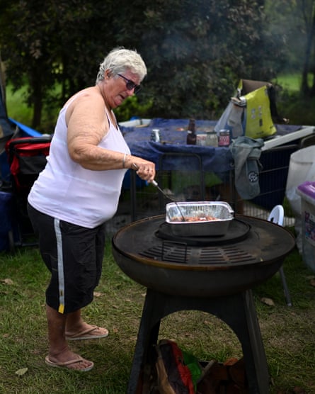 Gale Morgan prepares food at the makeshift camp on the outskirts of Gympie.