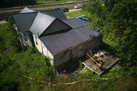 a house surrounded by tape