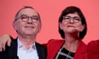 Merkel government in peril as leftwing duo take charge of SPD