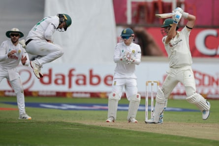 South Africa’s Ryan Rickelton (second left) jumps to field a ball played by Australia’s Pat Cummins on day one of the first Test match between South Africa and Australia.