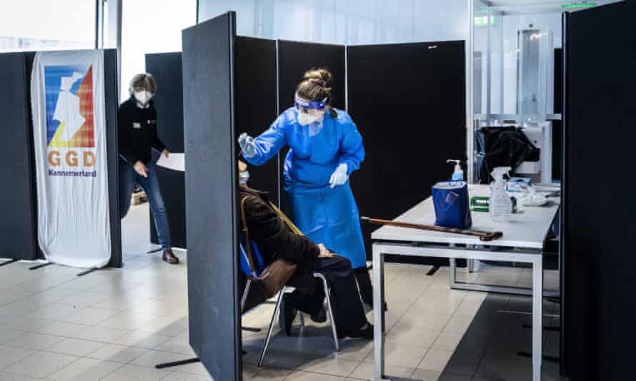 A passenger being tested for the Omicron variant at Schiphol airport in Amsterdam
