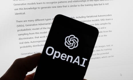 A phone is held displaying the OpenAI logo with text on a screen behind it