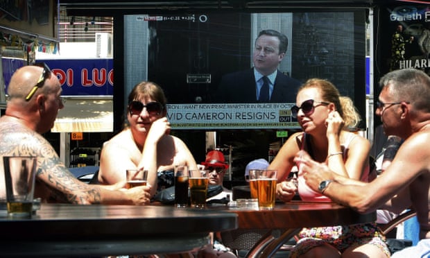 A TV screen at a bar in Benidorm displays David Cameron’s announcement of his resignation