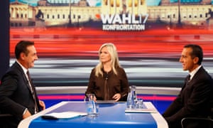 Heinz-Christian Strache, left, head of the Freedom party, presenter Claudia Reiterer and incumbent chancellor Christian Kern, right, on the TV debate in Vienna.
