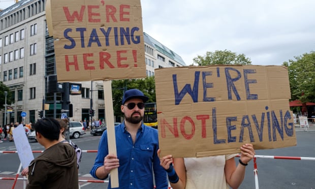 Britons living in Germany hold up signs in protest at Brexit in Berlin last July.
