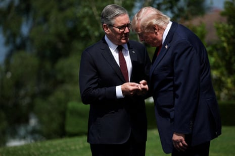 Prime Minister Sir Keir Starmer (left) and U.S. President Donald Trump talk ahead of a family photo during the G7 summit in Evian, France