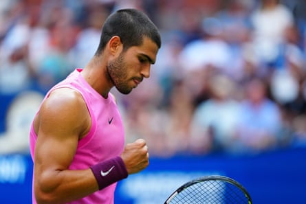 Carlos Alcaraz celebrates during his semi-final against Novak Djokovic.