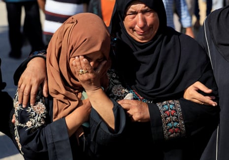Mourners react during the funeral of Palestinians killed on Tuesday morning.
