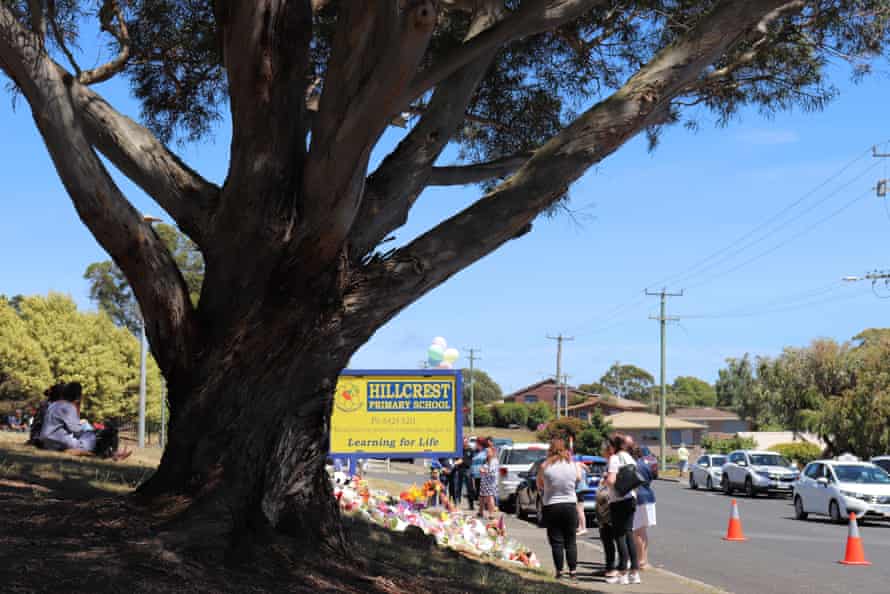 People leave flowers and tributes outside Hillcrest Primary School in Devonport, Tasmania.