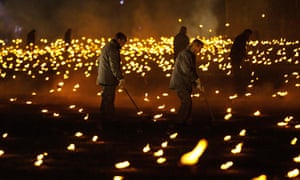 Volunteers and representatives from the armed forces helped to the light the torches.