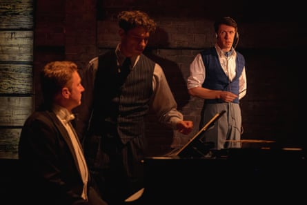 Malcolm Forbes-Peckham at the keyboard as Szpilman’s wartime self, Krikler pointing out something in the music on the piano, and Oliver Grant as Hosenfeld in the background.