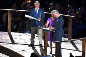 Te baton is delivered to Prince Charles, Prince of Wales to read the message from the Queen and declare the games open.