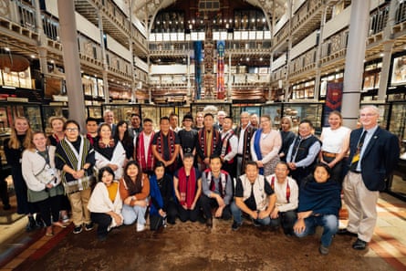 A group of people assembled for a photo in a Museum