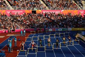 Competitors take part in the women’s 400m hurdles final