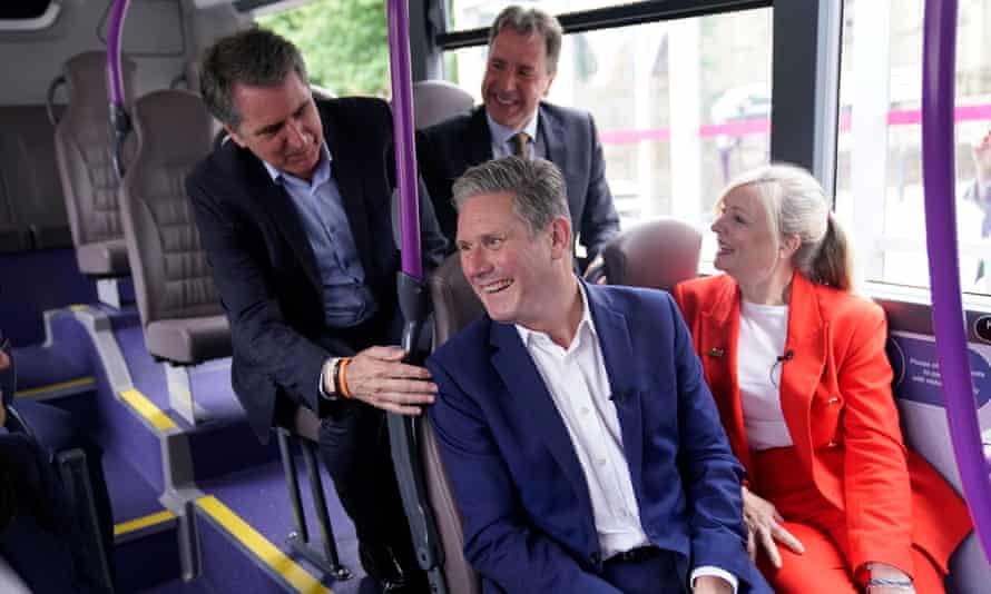 Keir Starmer visiting a park and ride in Leeds, where he was meeting Labour mayors on Thursday. Back row: Steve Rotheram, the mayor of Liverpool city region, and Dan Norris, the West of England mayor. Front row: Starmer and Tracy Brabin, the mayor of West Yorkshire.
