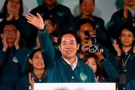 Taiwan president-elect Lai Ching-te gestures as he attends a rally in Taipei after victory in the presidential elections
