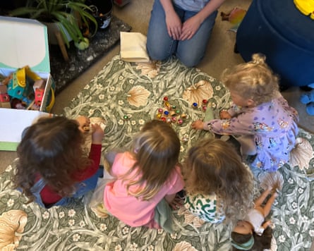 Four toddlers playing with toys