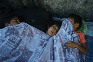 Children sleep outside the station