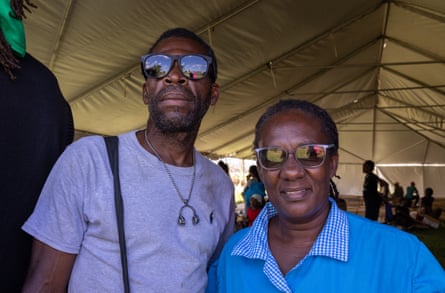 two people wearing sunglasses smiling