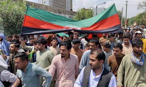 Street full of men with Afghan flag