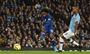 Chelsea’s Willian shoots past Manchester City’s Fernandinho and wide of the goal.