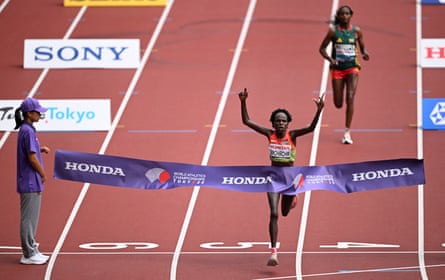 Peres Jepchirchir crosses the line to win the marathon ahead of Tigst Assefa