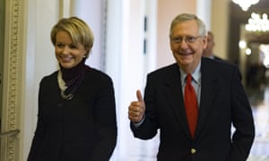 Mitch McConnell, the Senate majority leader, pictured with a staffer from his office, gives a thumbs-up sign. He said a final vote was expected late on Friday.