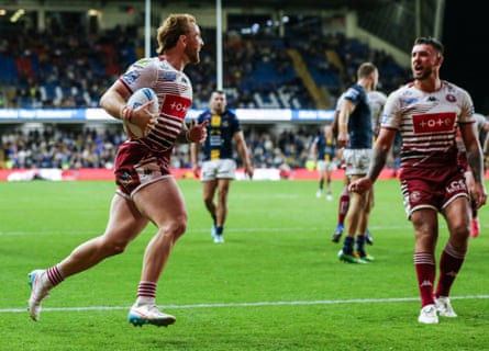 Adam Keighran of Wigan Warriors scores a try