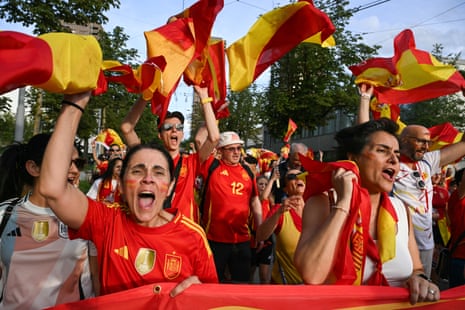 Spain's supporters cheer their team on as they arrive at the Letzigrund Stadium