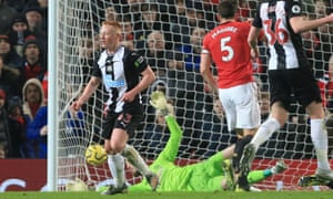 Newcastle United’s Matthew Longstaff (left) scores the opening goal past Manchester United’s goalkeeper David de Gea.