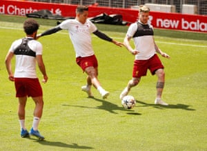 Liverpool’s Roberto Firmino, challenges Alberto Moreno.