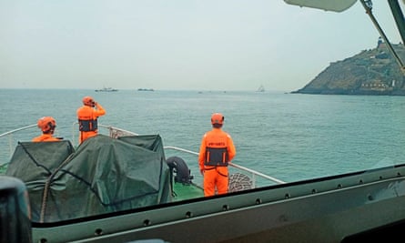 Members of Taiwan’s coast guard work during a rescue operation after a boat capsized near Taiwan-controlled Kinmen islands on 14 March
