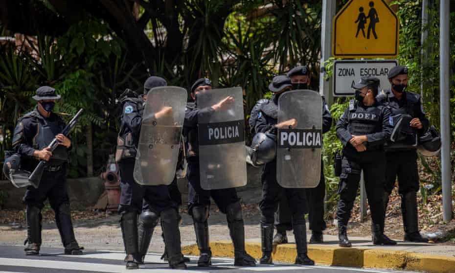 Riot police secure the perimeter of the home of Cristiana Chamorro in Managua on 2 June. 
