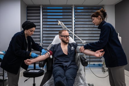 A man undergoing a series of blood tests