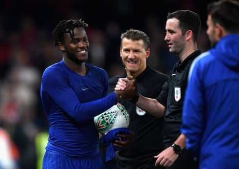 Michy Batshuayi of Chelsea collects the match ball.