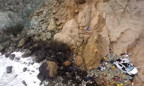 View from the helicopter during a rescue operation after a vehicle carrying two adults and two children went over a cliff in Devil's Slide, San Mateo county, California.