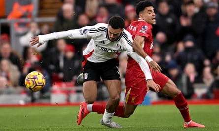 Antonee Robinson of Fulham emerges with the ball after a battle with Liverpool’s Luis Díaz