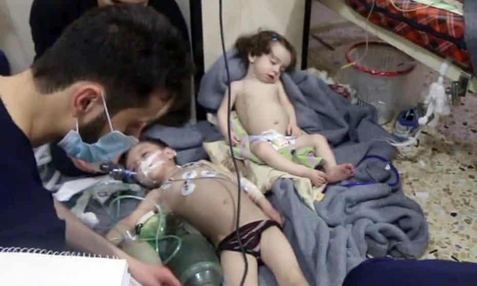 Children after attack on Douma