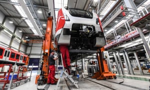 Bombardier employees work on an S-Bahn train at a plant in Bautzen, Germany.