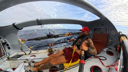Aurimas Mockus in the Kursis, the one-seater boat he rowed across the Pacific Ocean