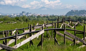 The city of Ljubljana is seen over the green hill of Ljubljana’s old landfill and its methane gas pipes on May 10, 2019. Zero waste in Ljubljana, Slovenia