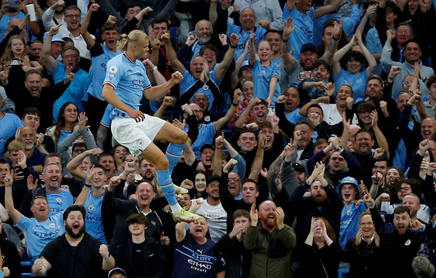 Erling Haaland celebrates in front of the jubilant Manchester City fans after scoring his second goal.