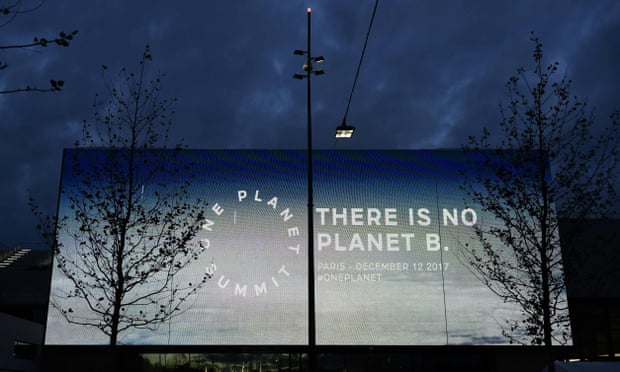 A screen reading ‘There is no planet B,’ outside the One Planet Summit in Paris